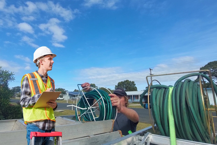 
Hose setup in motion after effective gutter rinsing by wollongong cleaner.