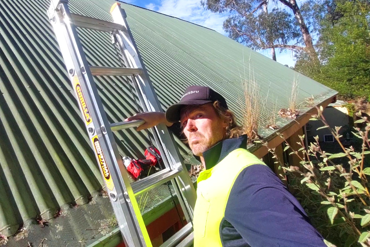 Local Gutter Cleaner Examines a Failed Gutter Guard in wollongong